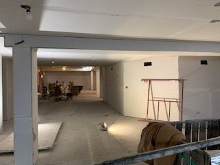 Drywallers had Midway rocked and taped within days. These guys don't mess around.